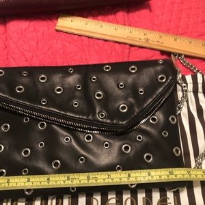 Henri Bendel black leather convertible purse.